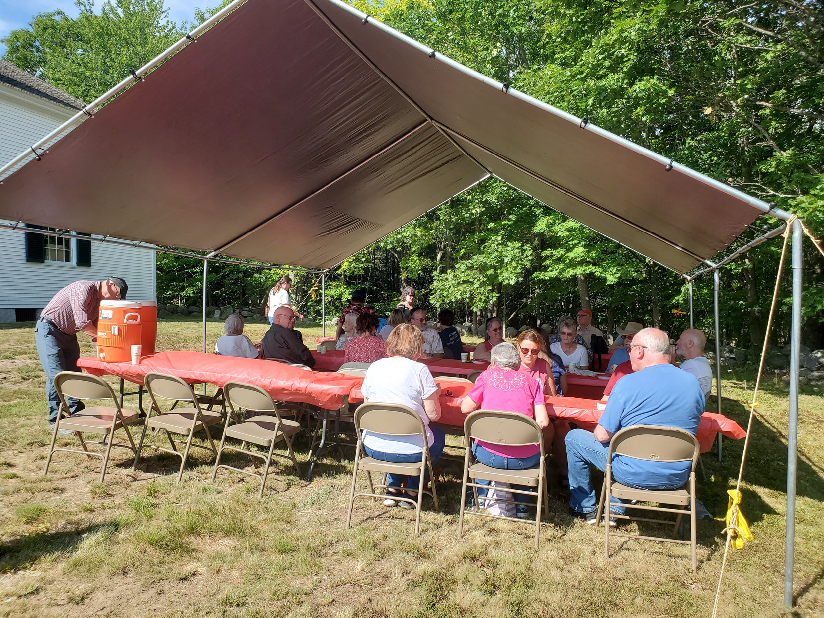Guests gathered outdoors for refreshments at the Strawberry Festival at Bell Hill Meetinghouse.