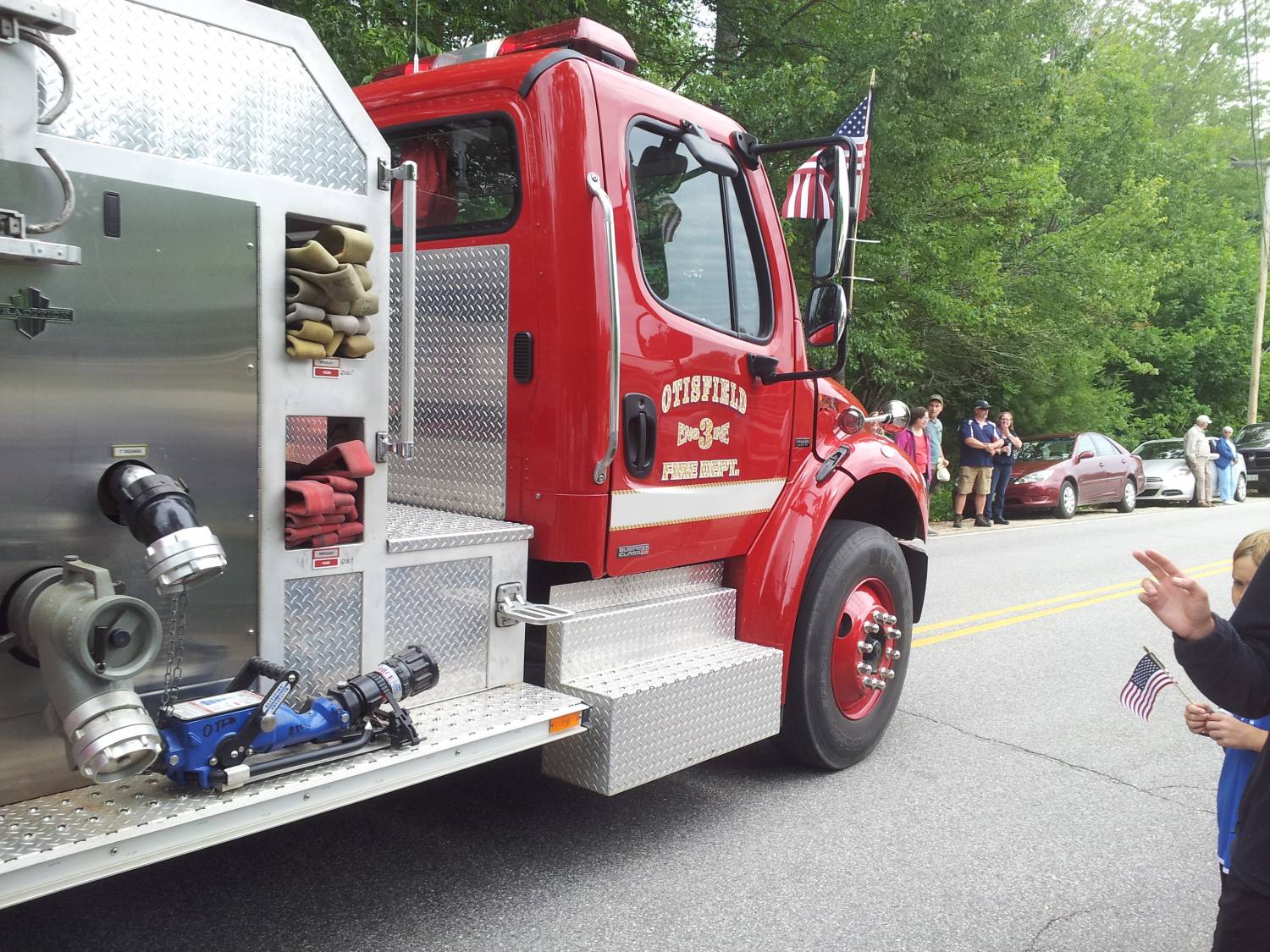 Otisfield Engine 3 with hoses and pump fittings at the Fourth of July parade.