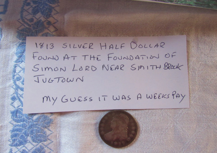 An old coin, found by Larry Nadeau in Jugtown, that was displayed as part of our June program on Old Cellar Holes.