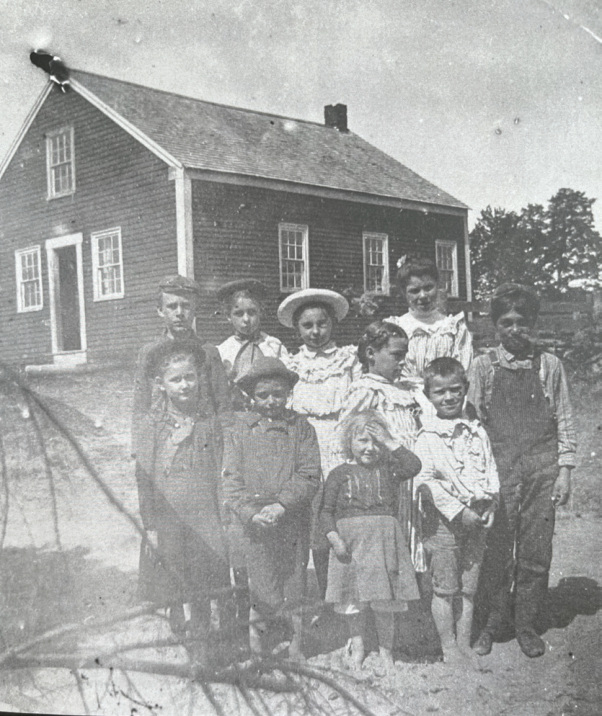 An 1899 picture showing school children in front of the South Otisfield Schoolhouse